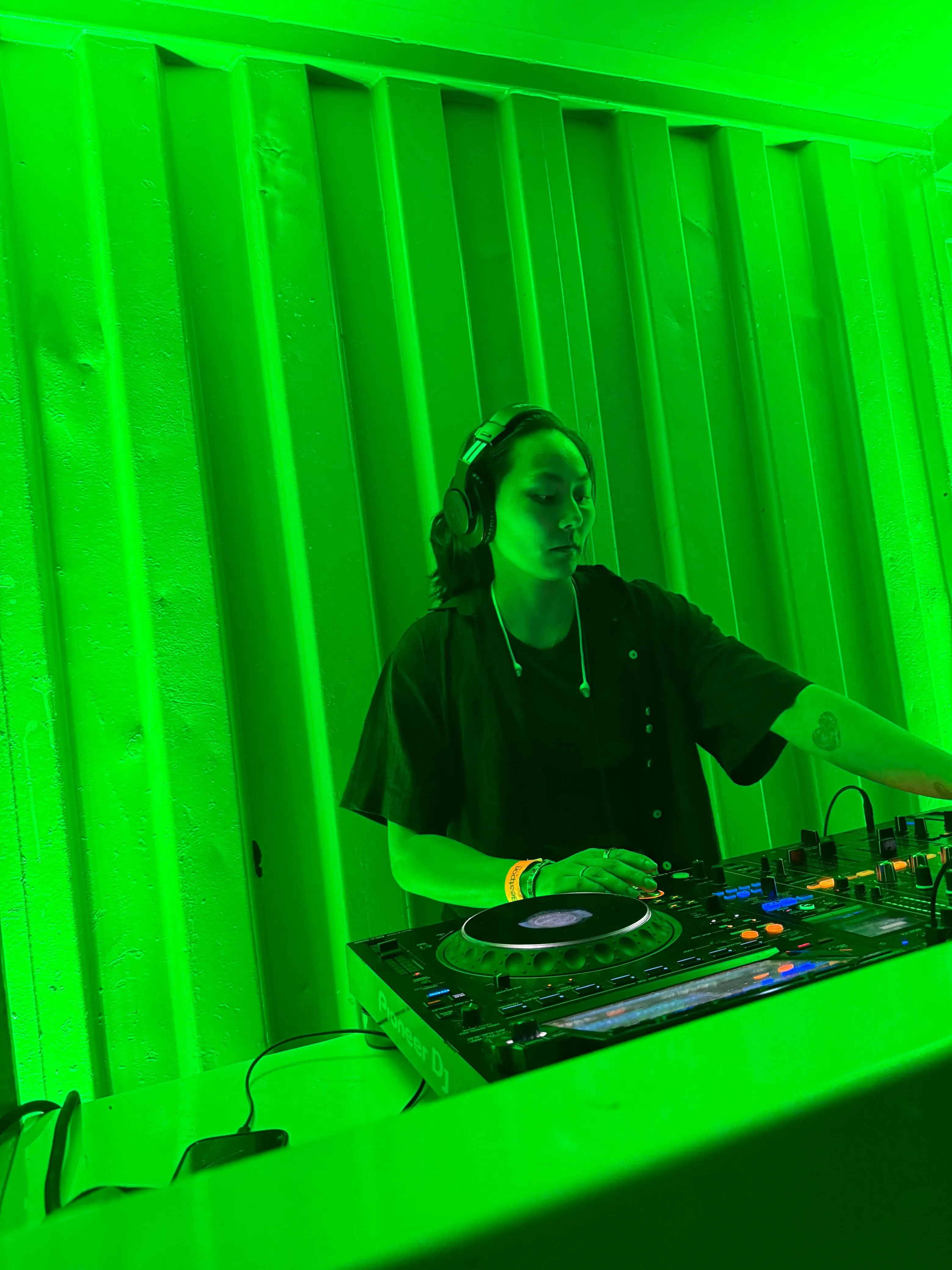 Green lit DJ performance